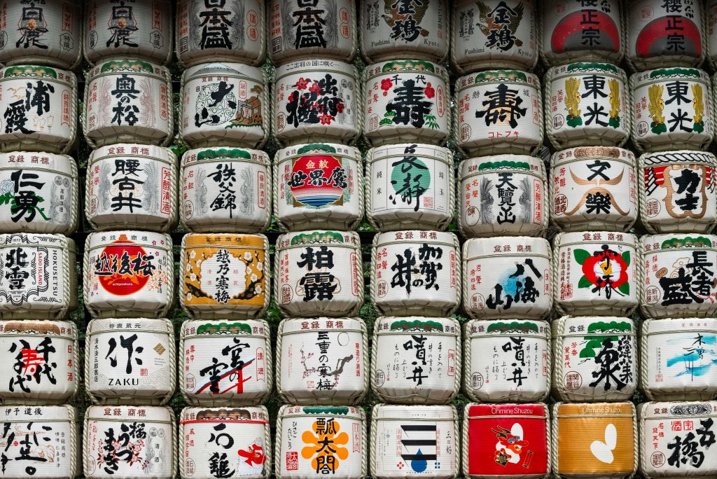 A collection of traditional sake barrels in Shibuya, Tokyo, showcasing Japanese culture.